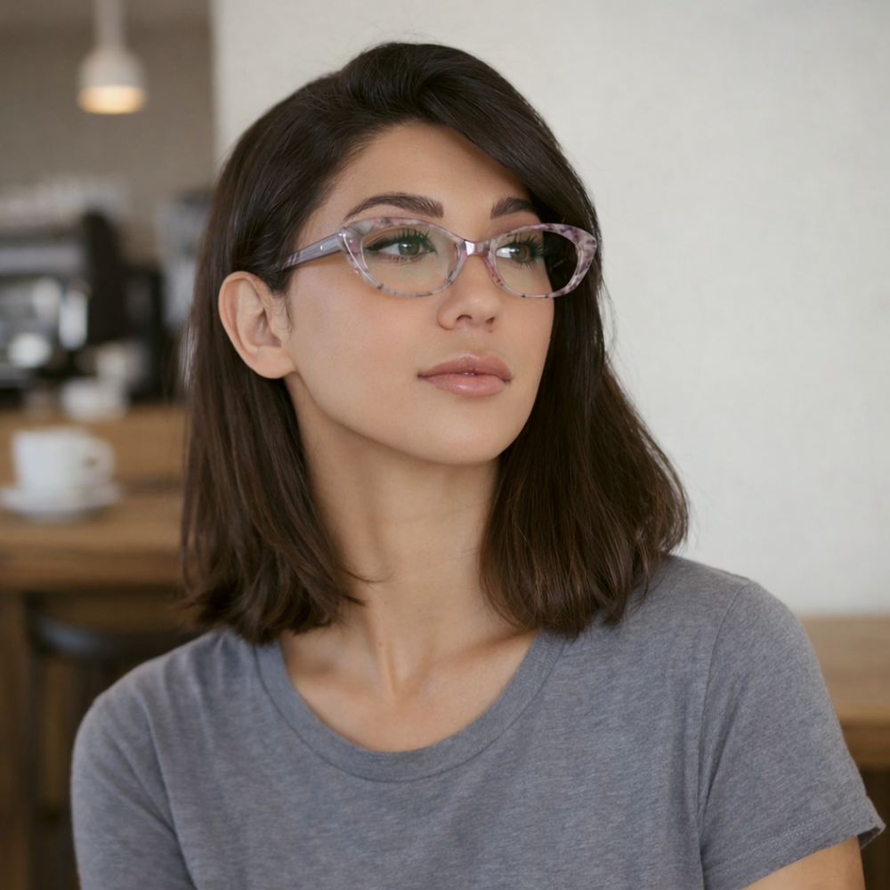 wearing cat-eye reading glasses in a translucent pinkish frame  with clear blue light blocking lenses | Renee's Readers 