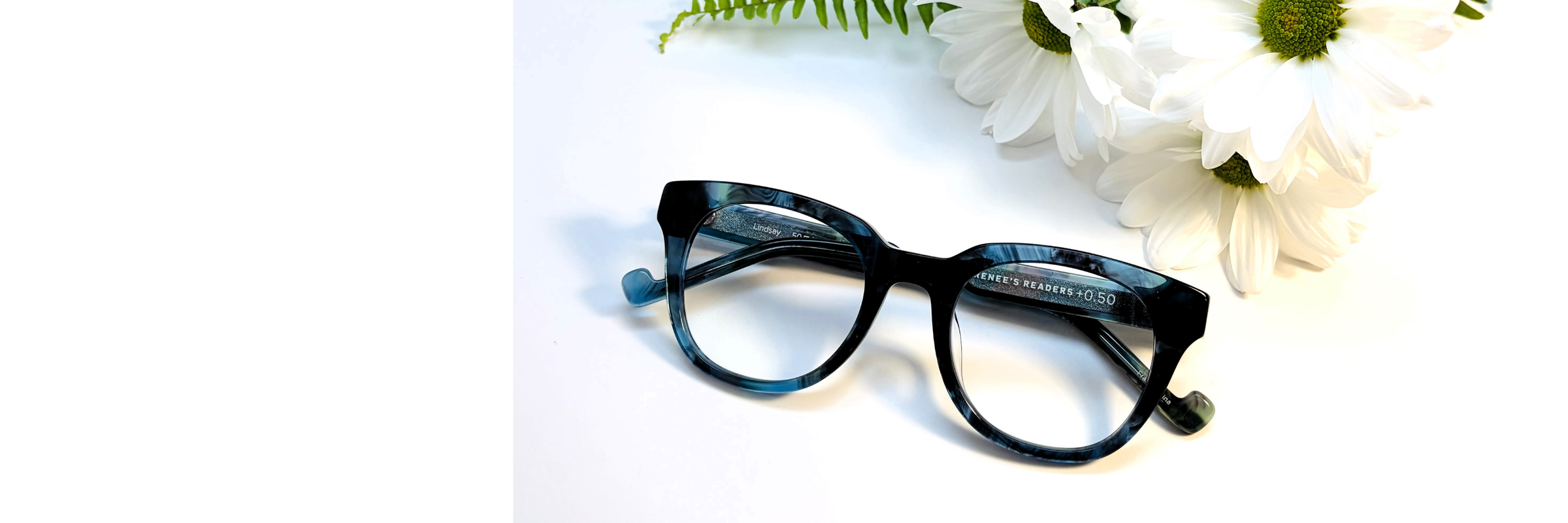 reading glasses for mom on Mother's Day with white flowers 