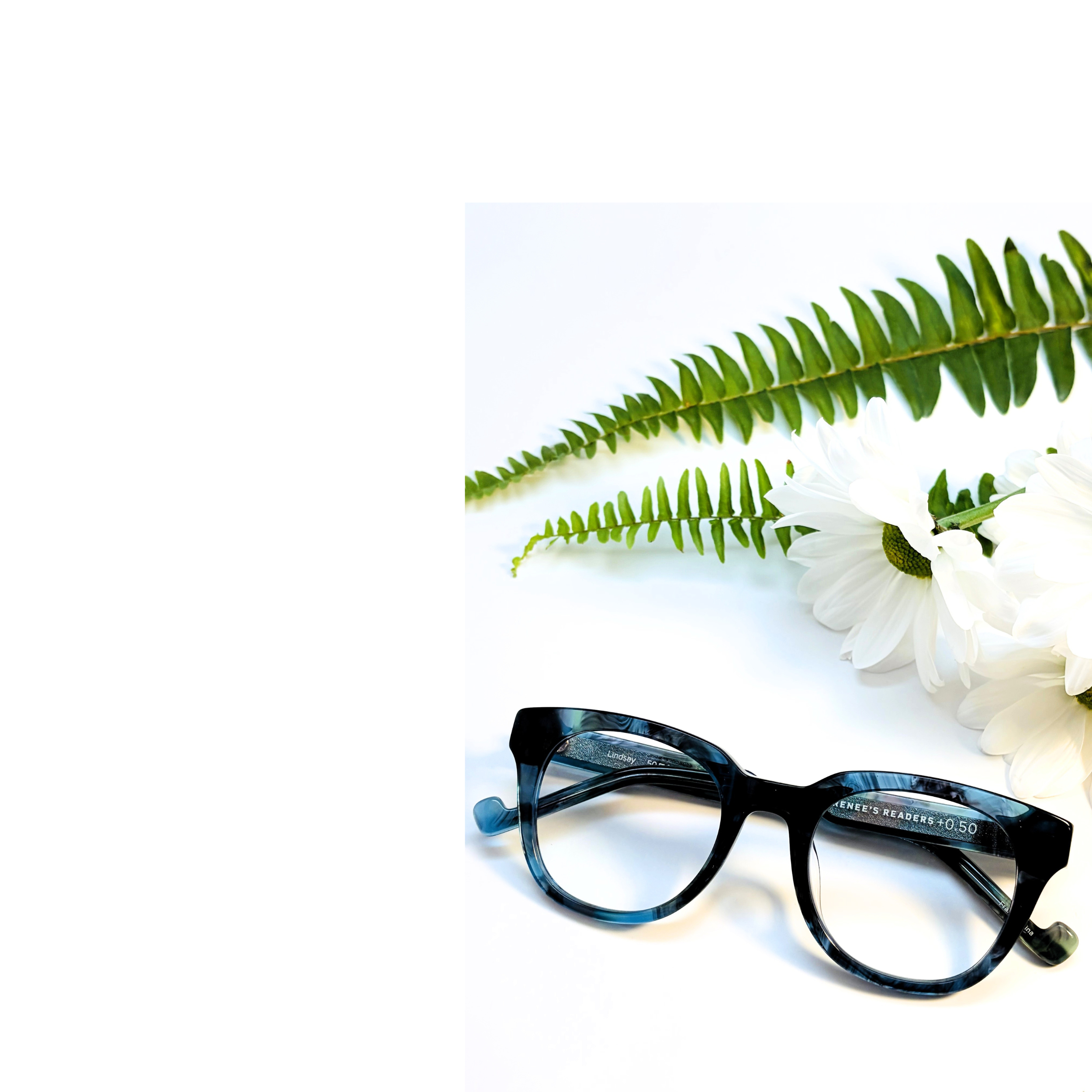 reading glasses for mom on Mother's Day with white flowers 