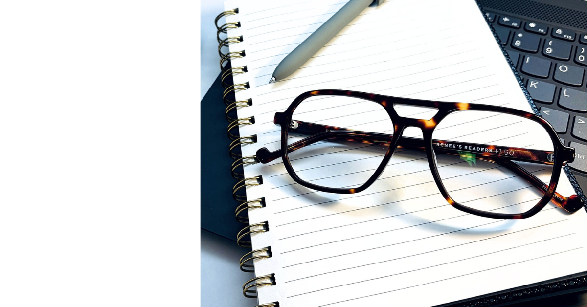 Aviator tortoiseshell reading glasses  next to laptop keyboard -RENEE'S READERS