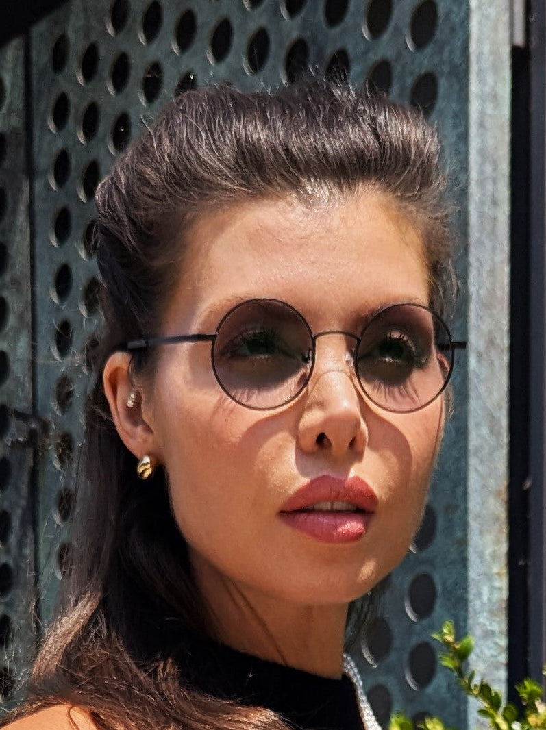 Woman wearing round sunglasses  Renee's Readers