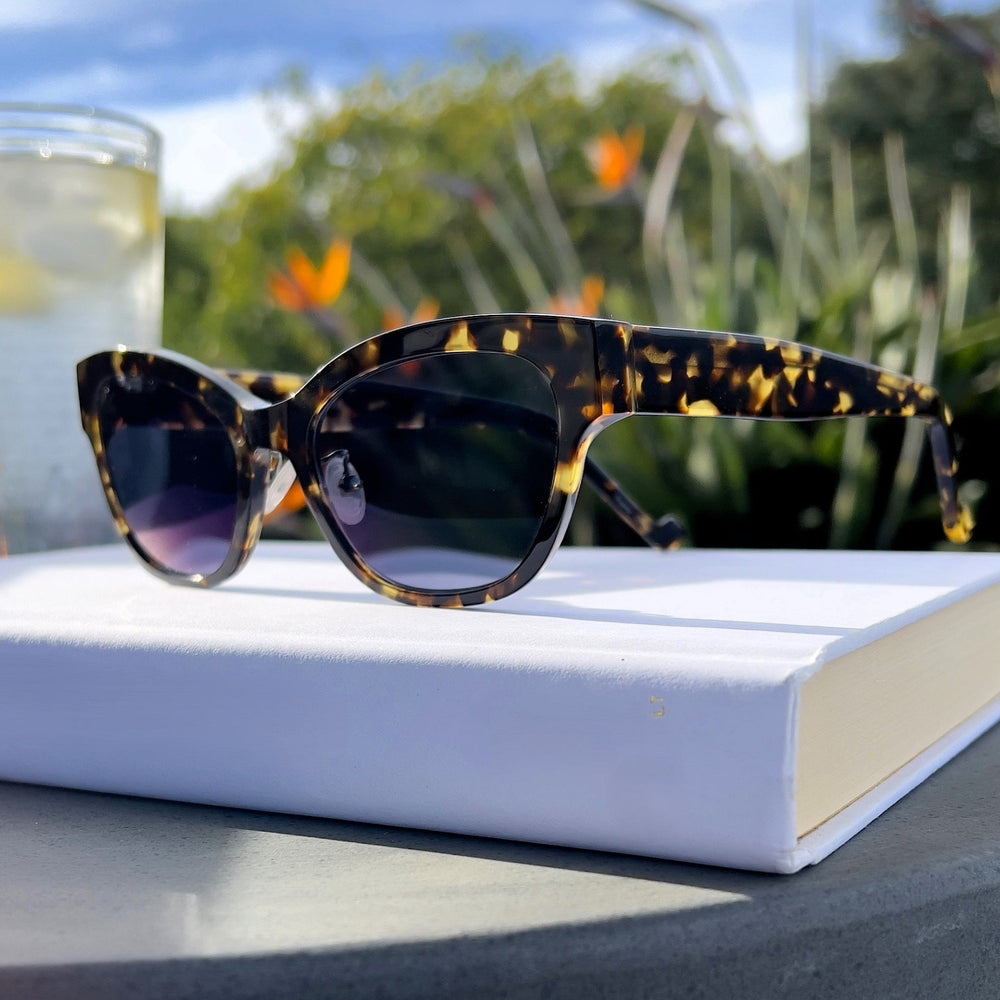 Sunglasses on a book Renee's Readers