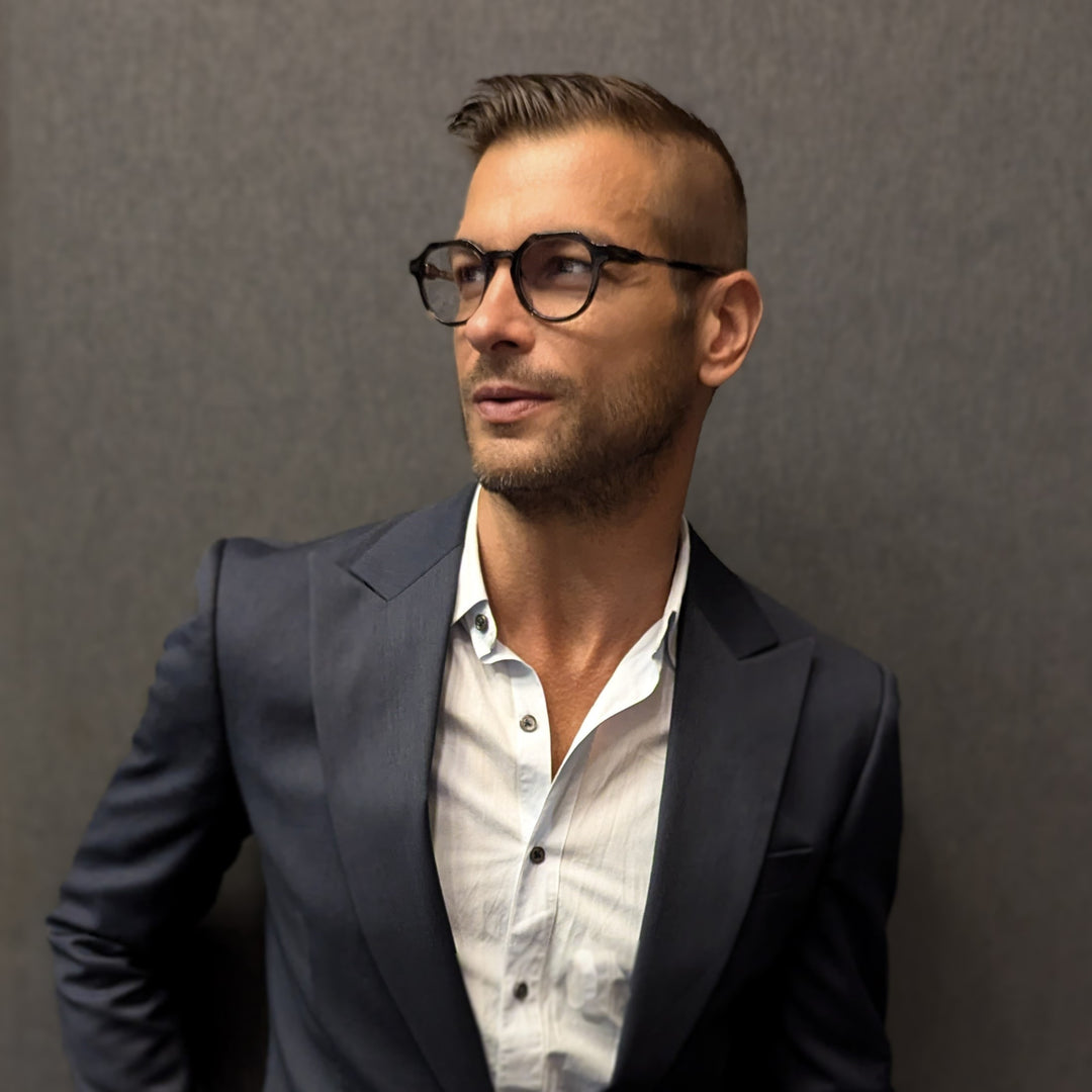 Man wearing reading glasses abackground